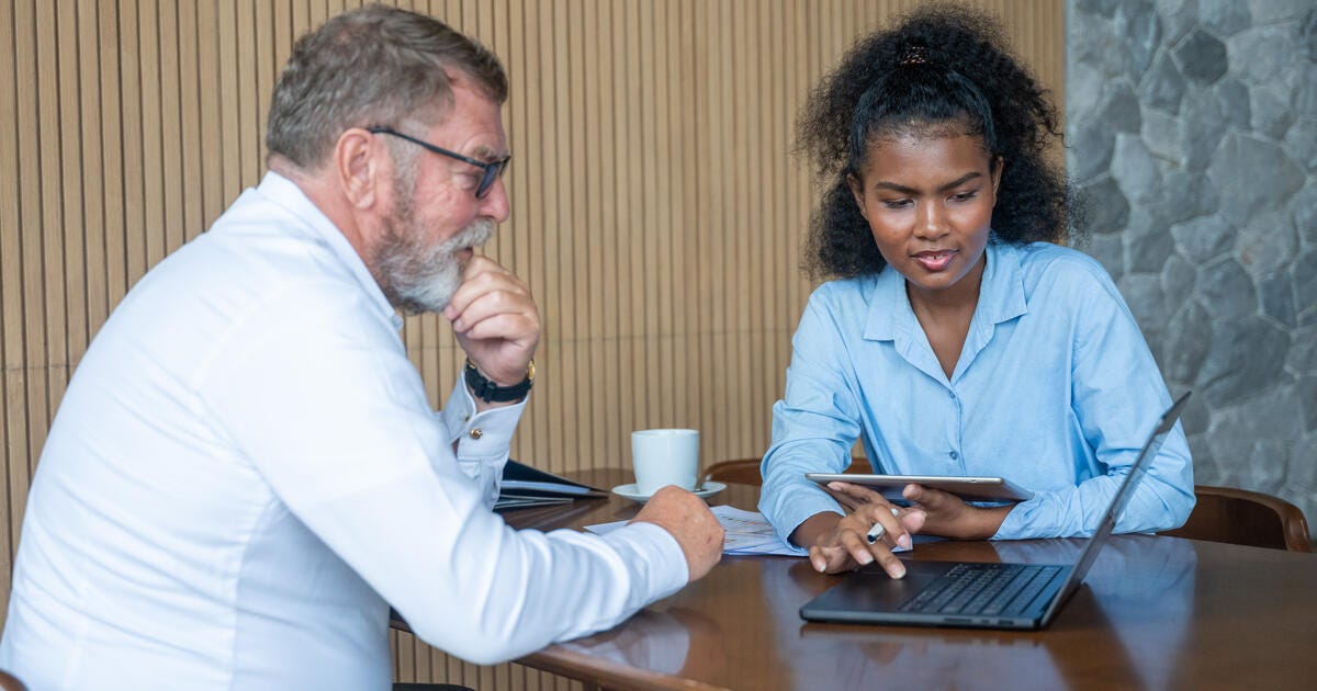 Manager and his secretary are business meeting office showing information.
