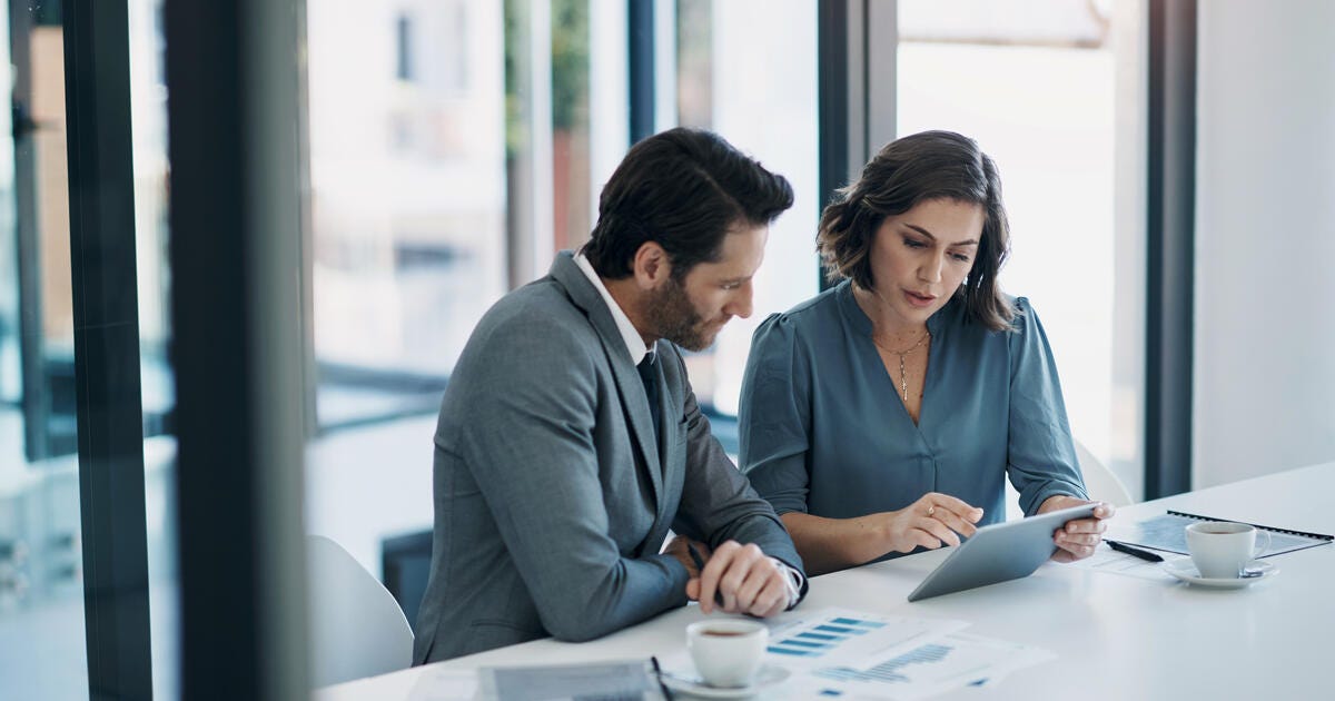 Image of business people discussing financial plans.