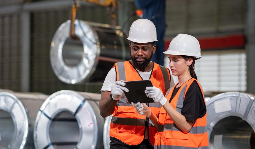 Professional photograph depicting workers in a manufacturing environment