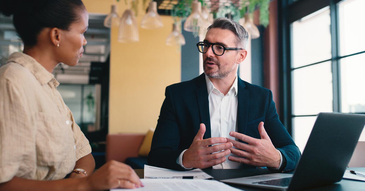 Meeting, discussion and people in office for business.